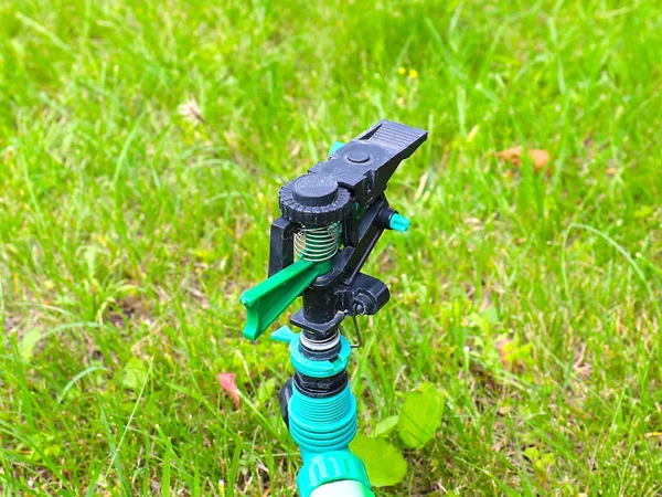 Plastic Sprayer Watering Lawn Grass — Stock Photo, Image