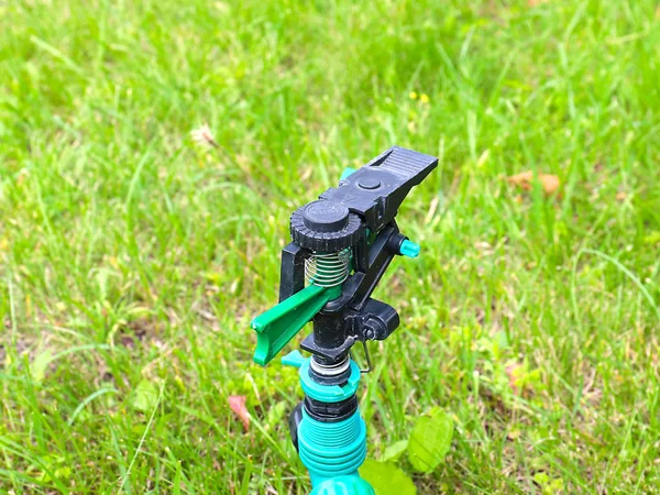 Plastic Sprayer Watering Lawn Grass — Stock Photo, Image