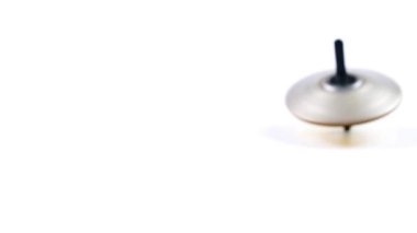 dönen bir üst denge hareketinin sembolü olarak çılgınca döner