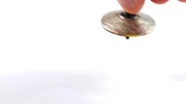 dönen bir üst denge hareketinin sembolü olarak çılgınca döner