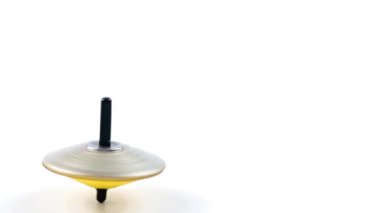 dönen bir üst denge hareketinin sembolü olarak çılgınca döner