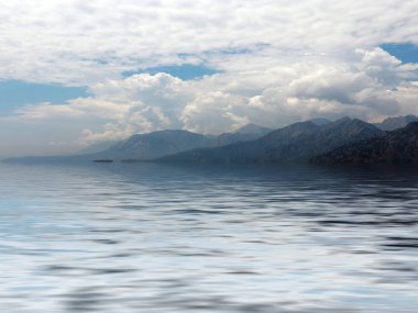 Akdeniz'in suyunda bir dağ sırasının zirvelerinin yansıması