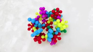 Plastik çocukların inşaat malzemeleri bir su akışında virüs molekülü şeklinde bir araya getirildi.