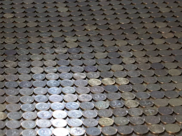 a plane of metal coins laid out in a row Russian ruble