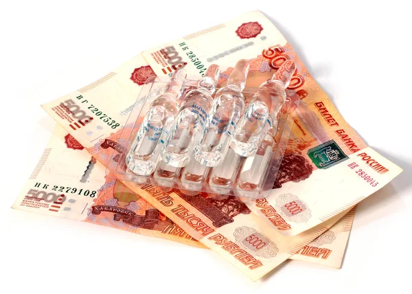 ampoules with medicines and a lot of paper Russian rubles