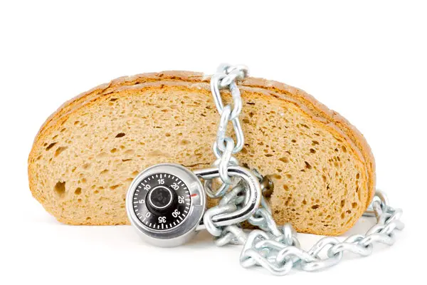 Fette di pane chiuse con lucchetto — Foto Stock