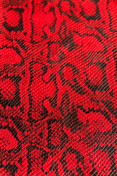 Texture of synthetic red snake skin — Stock Photo, Image