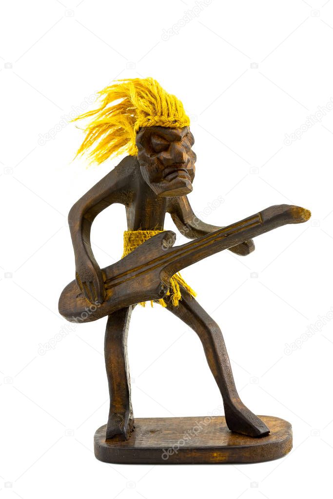 A wooden figure of a guitarist with hair and a hemp belt