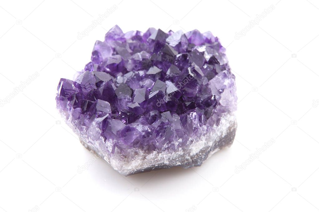 Purple Amethyst gemstone over white background