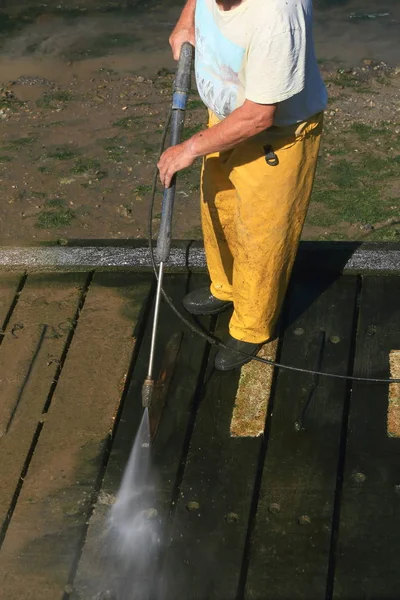 Fisherman Cleaning Dock Water Hose — Stock Photo, Image