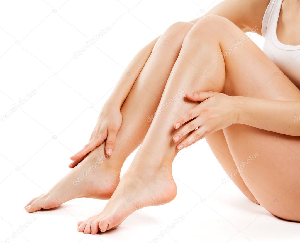Legs Beauty Skin Care, Woman Smooth Body, Female Sitting Isolated over White Background and Touching Hairless Leg