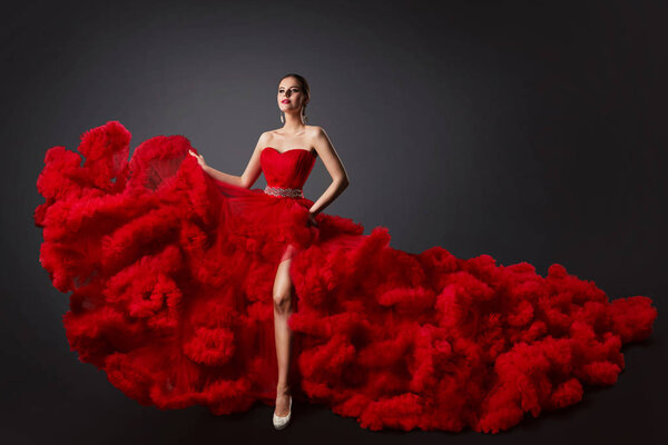 Woman in Red Ruched Dress, Fashion Model in Long Fluffy Waving Gown
