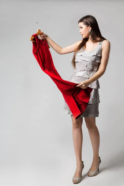 Woman Holding Red Dress on Hanger, Beautiful Girl Choosing Clothes — Stock Photo, Image