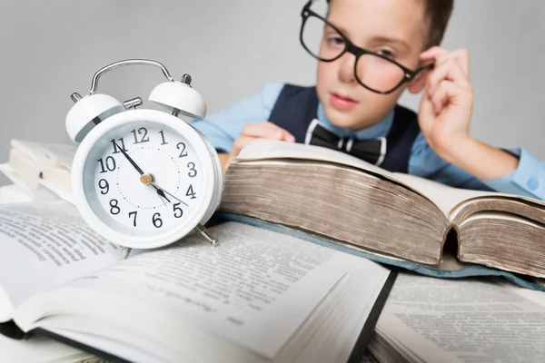 Child Reading Books behind Clock Alarm, School Boy Learning Hard Lessons — Stock Photo, Image