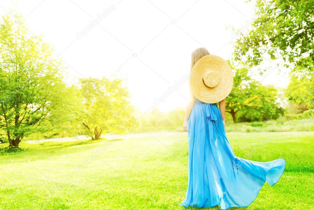 Woman Back Rear View In Nature, Beautiful Elegant Girl in Long Blue Dress Hat in Summer Green Park