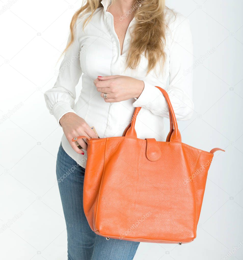 Woman with hand bag and credit card