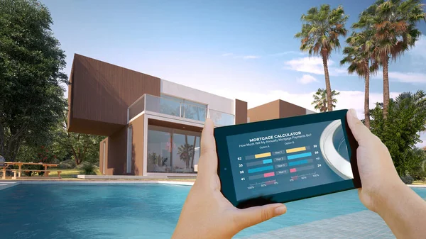住宅ローン計算機と背景に豪華な家を持つモバイルデバイスの3Dレンダリング — ストック写真