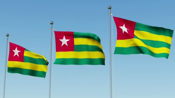 Drei Flaggen Von Togo Wehen Wind Vor Blauem Himmel Dreidimensionale — Stockvideo