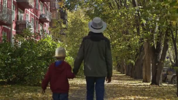 Big Brother Walking His Younger Hand Path House Golden Autumn — Stock Video