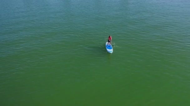 Aerial View Tenage Boy Stand Paddling Sea Beautiful Sunny Day — Stock Video