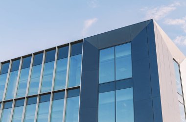 Shot of the Glass Elevation of an Office Building clipart