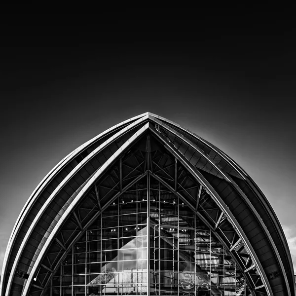 A fine art black and white edit of the armadillo auditorium in Glasgow near to the river clyde.