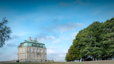 KLAMPENBORG, DENMARK - OCTOBER 03, 2020: Hermitage Palace at dyrehaven deer park in Denmark. clipart