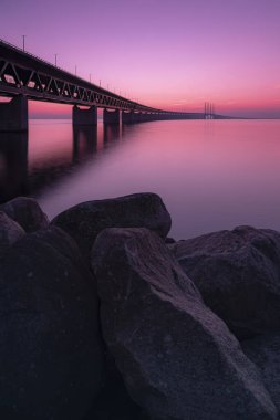 MALMO, SWEDEN - SEPTEMBER 20: The oresunds bridge that connects Sweden with Denmark at sunset. clipart
