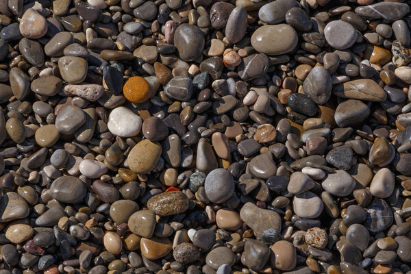 abstract natural background: pebble stones on beach in Nice