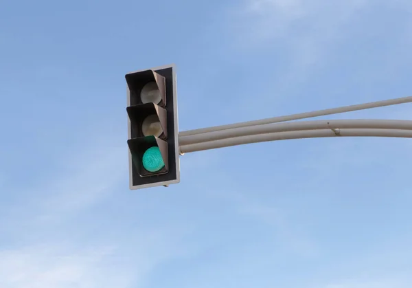 traffic light with green signal against blue sky in Nice, France