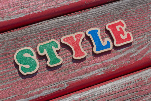 Word style made of wooden letters on wood bench