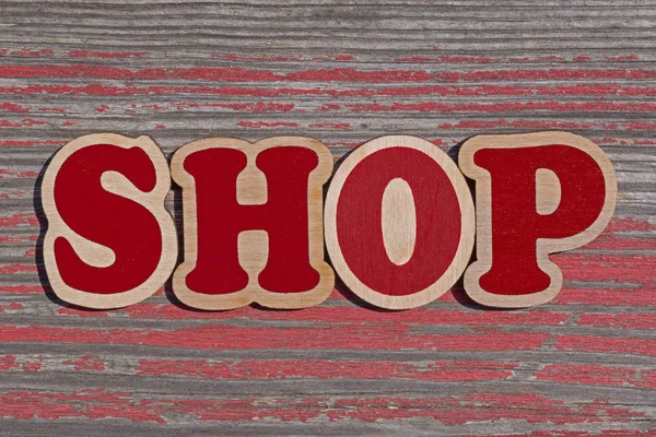 木制板上的木制字母做的文字店 — 图库照片