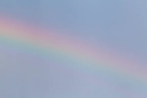 close up of rainbow in a sky at rain