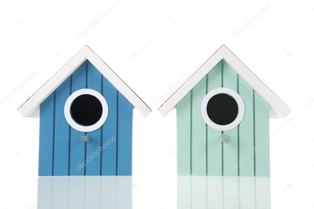 Many colorful bird boxes isolated over white background
