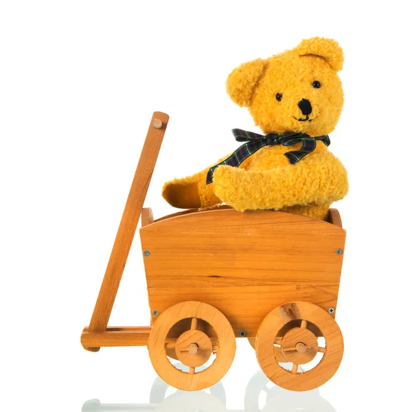 Stuffed toy bear with bow in cart — Stock Photo, Image