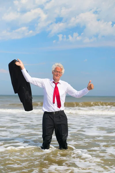 Business man standing at the beach — Stock Photo, Image