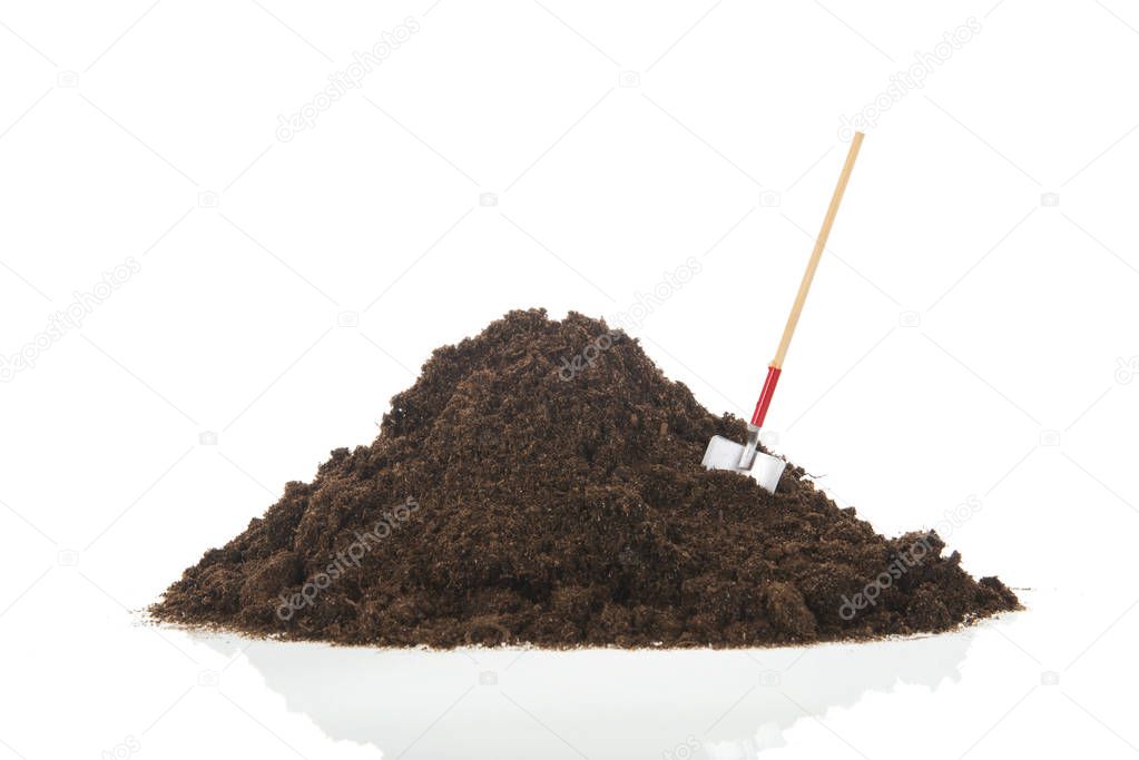 Black heap earth with shovel isolated
