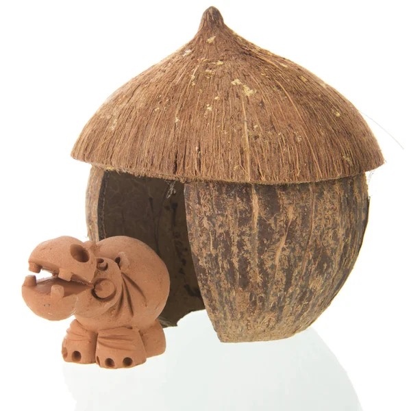 Tropical straw hut with hippo — Stock Image Tropical straw hut with hippo Stock Photo