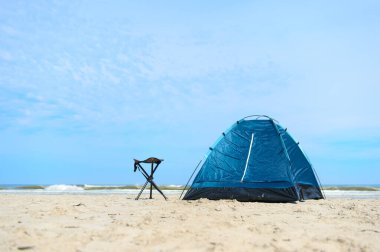 Camping with tent at the beach clipart