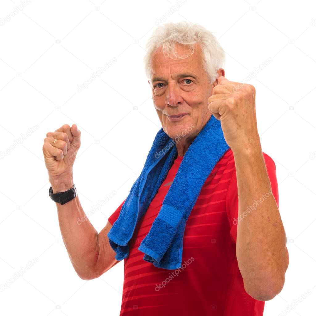 Portrait senior sport man in red with blue towel against white background