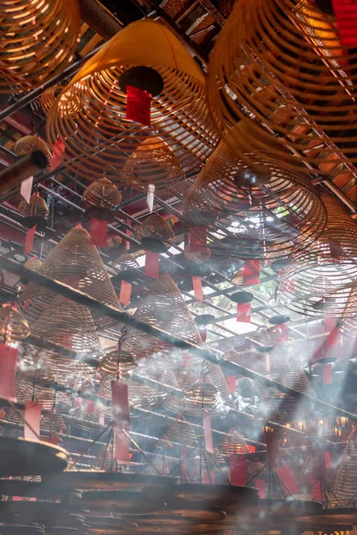 Jesus Light and the hanging incenses inside the Man Mo Temple in Hong Kong