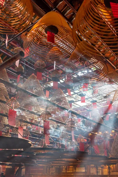 Jesus Light and the hanging incenses inside the Man Mo Temple in Hong Kong