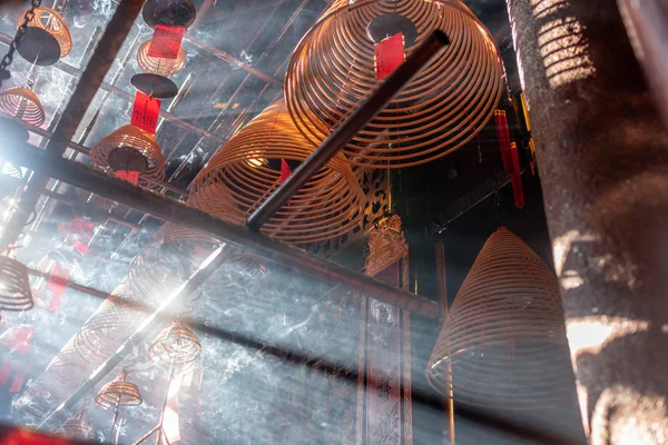 Jesus Light and the hanging incenses inside the Man Mo Temple in Hong Kong