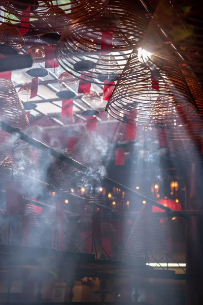 Jesus Light and the hanging incenses inside the Man Mo Temple in Hong Kong