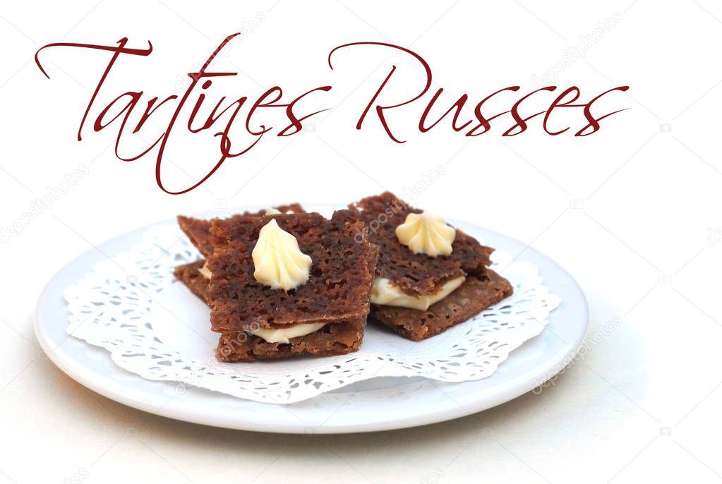 Mini tartines-russes on plate, on white, with easy removable French text Tartines Russes meaning russian sandwich, shallow dof