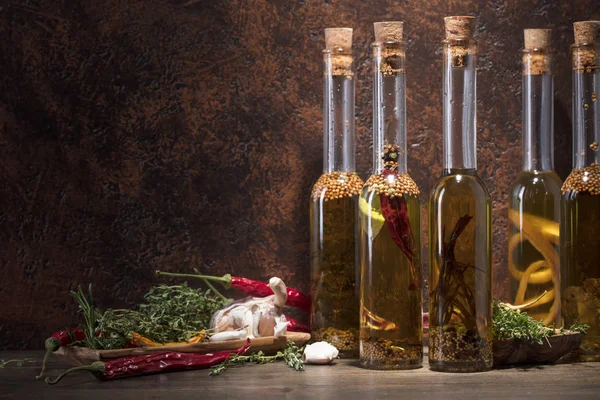 Bottles Olive Oil Old Wooden Table Olive Oil Different Spices — Stock Photo, Image