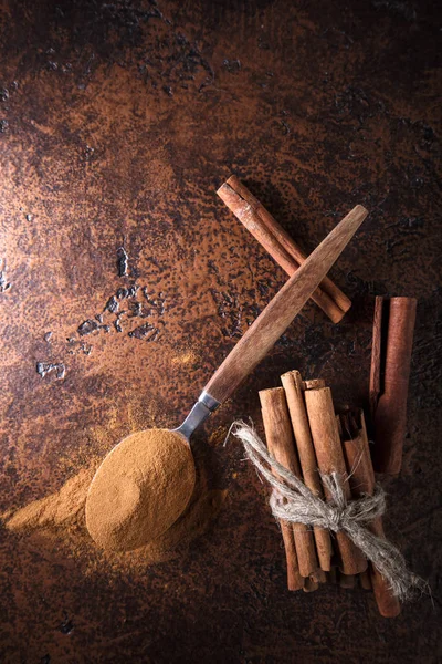 Cinnamon Sticks Powder Spoon Old Copper Table Copy Space Top — Stock Photo, Image