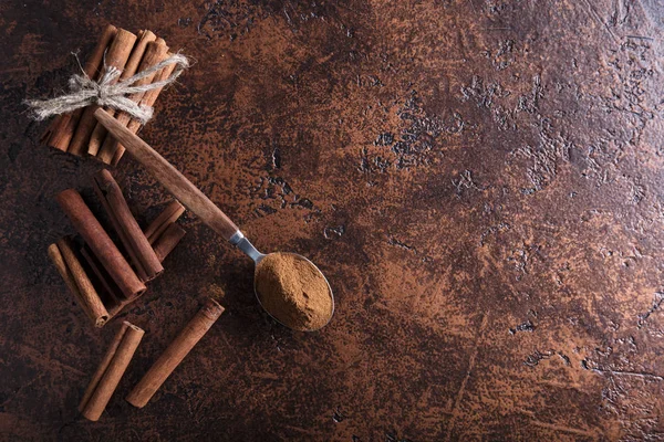 Cinnamon Sticks Powder Spoon Old Copper Table Copy Space Top — Stock Photo, Image