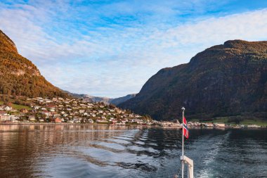 Scenic landscapes of the northern Norwegian fjords. Beautiful view of the coast of Sognefjord on a september day. The view from the cruise ship. clipart