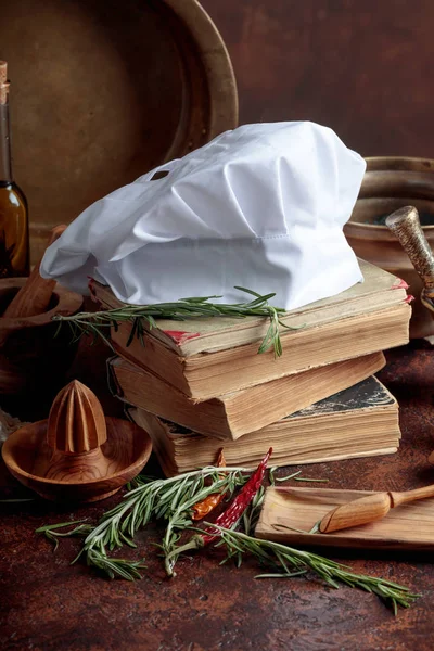White Chef Hat Old Cookbooks Kitchen Utensils Spices Rosemary Kitchen — Stock Photo, Image